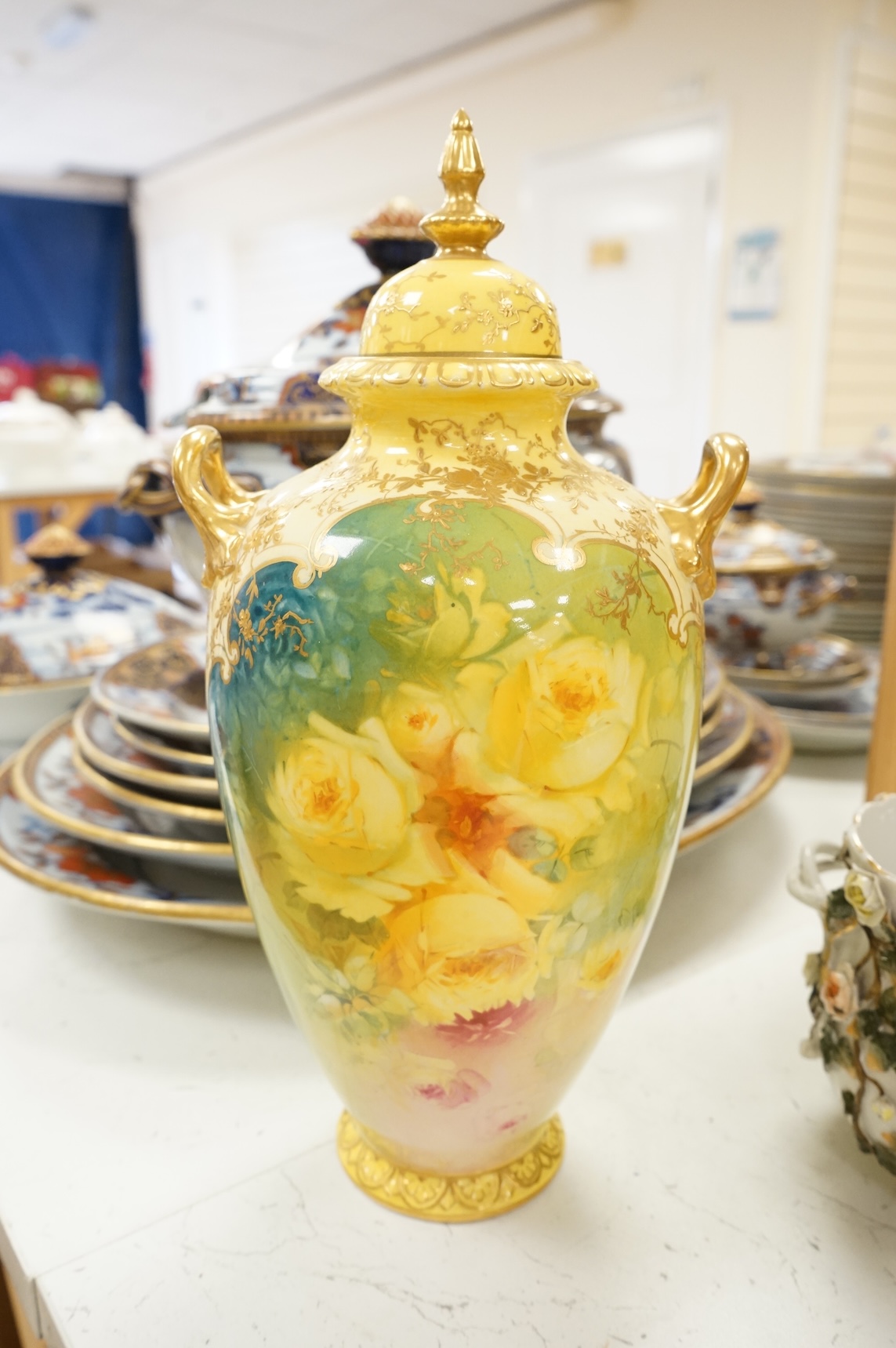 A pair of Bonn floral vases and covers, a modern Meissen vase, and an encrusted Sitzendorf vase, largest 35cm high